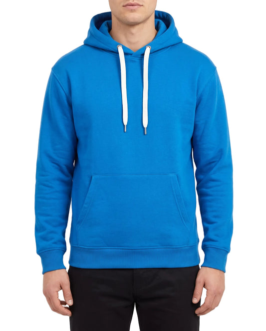 A man wearing a bright blue pullover hoodie with white drawstrings and a front kangaroo pocket, paired with black pants, against a plain white studio background.