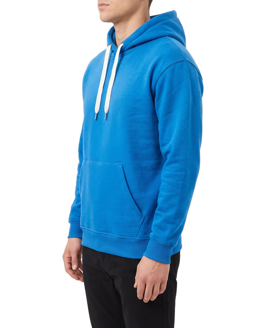 A man wearing a bright blue pullover hoodie with white drawstrings and black pants, shown in a side profile against a plain white studio background.