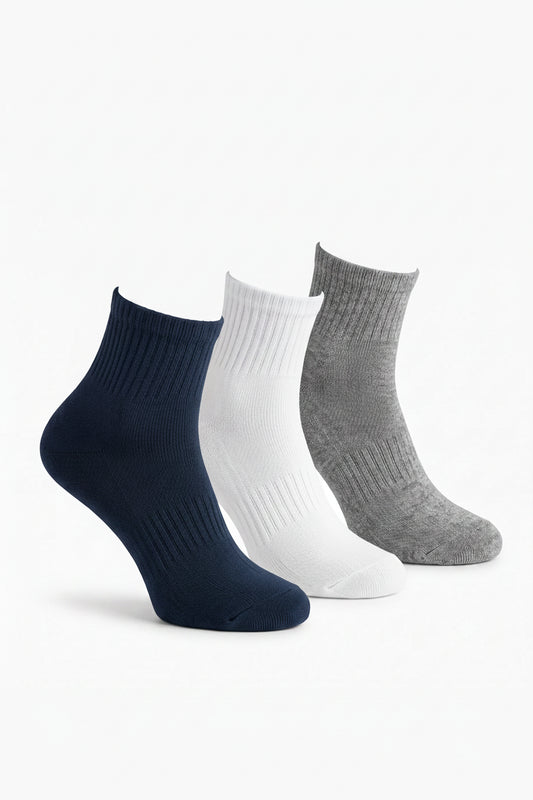 View of kids' cotton half-socket socks in navy blue, white, and grey by TREE.