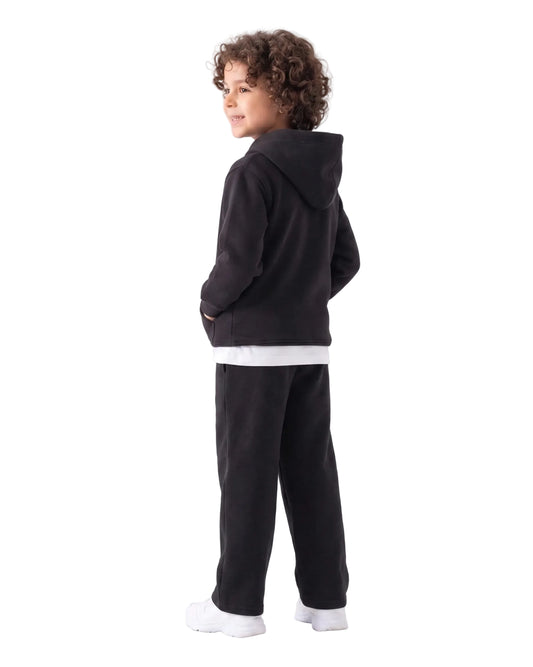 Front view of a young boy wearing a black milton hoodie by TREE.