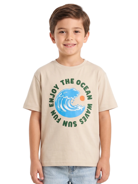 Child wearing a beige t-shirt with a graphic design of a wave and text on a white background