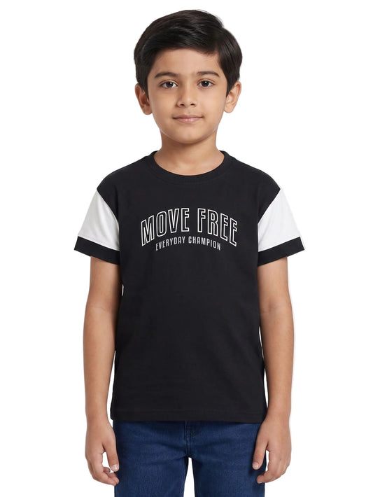 Child wearing a black and white t-shirt with 'MOVE FREE EVERYDAY CHAMPION' text on a white background