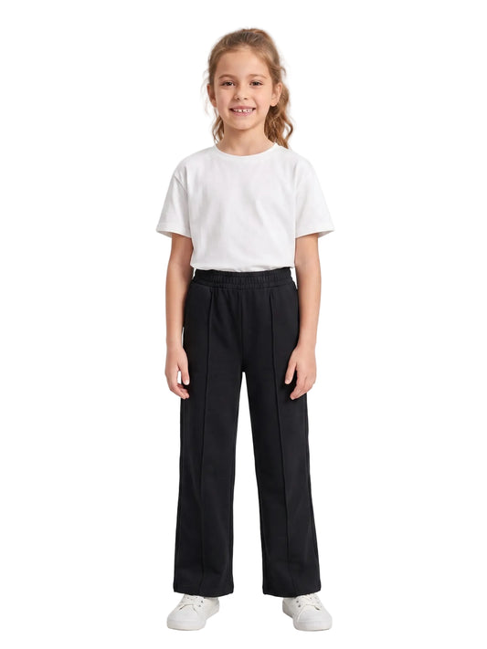 Front view of a young girl wearing summer black wide-leg sweatpants by TREE.