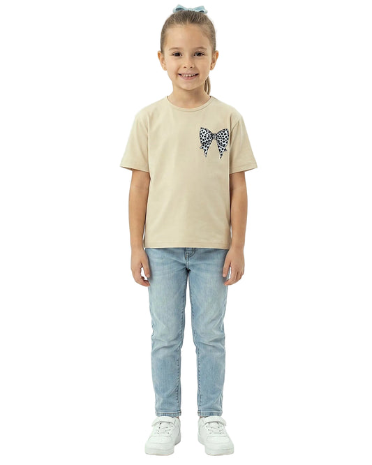 Back view of a girls' beige regular-fit t-shirt featuring a large leopard-print bow graphic on the back by TREE.