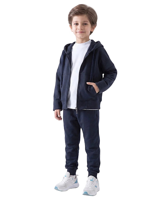 Front view of a boy wearing a dark navy kids' oversized zip hoodie jacket by TREE.