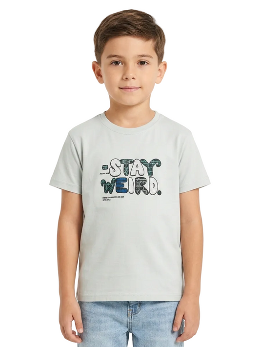 Child wearing a t-shirt with 'Stay Weird' text on a white background