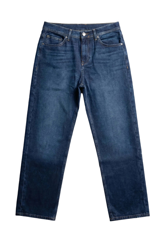 Front view of men's dark blue baggy fit jeans by TREE.
