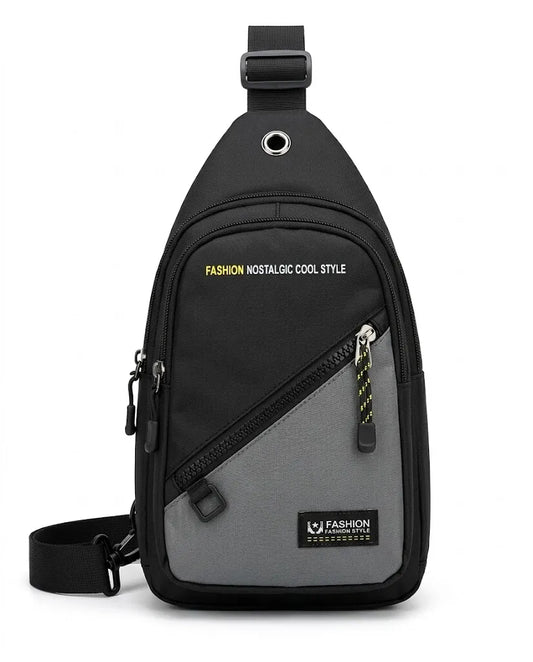 A black and gray sling Crossbody bag with a diagonal front pocket, black adjustable shoulder strap, and a black brand patch on the lower front.