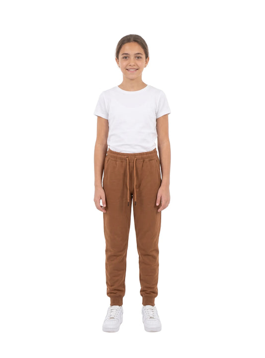 Close-up of the elastic waistband and drawstring on TREE's girls' brown sweatpants