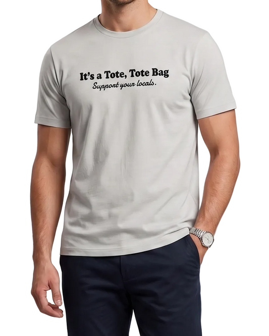 Person wearing a light gray t-shirt with text on a plain background