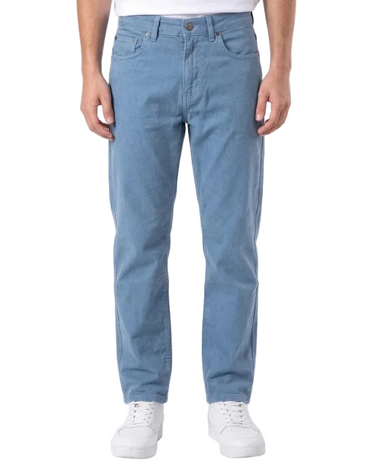 A person wearing light blue straight-leg denim jeans, a white t-shirt, and white sneakers, shown from the waist down against a plain white studio background.