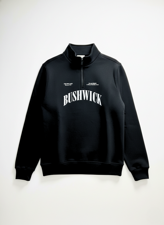 Black hoodie with 'BUSHWICK' text on a white background