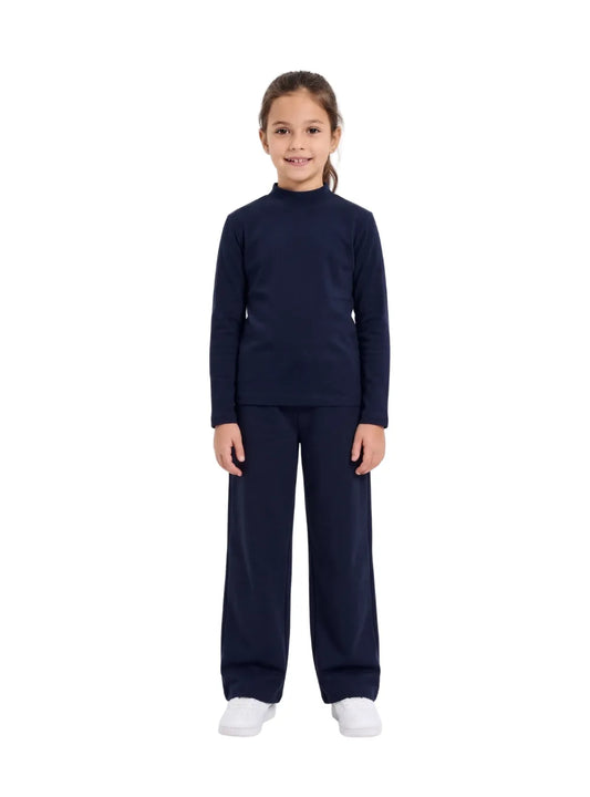 Front view of a young girl wearing a navy long-sleeve high-neck basic top by TREE.