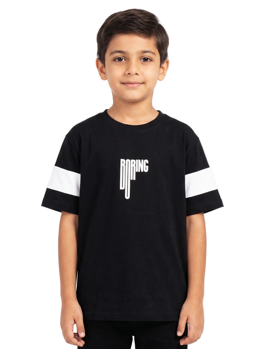 Child wearing a black t-shirt with white sleeves and 'BOING' logo on a white background