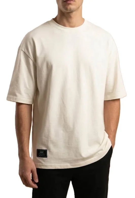Men's casual solid off-white oversized t-shirt with visible texture and black hem patch from TREE