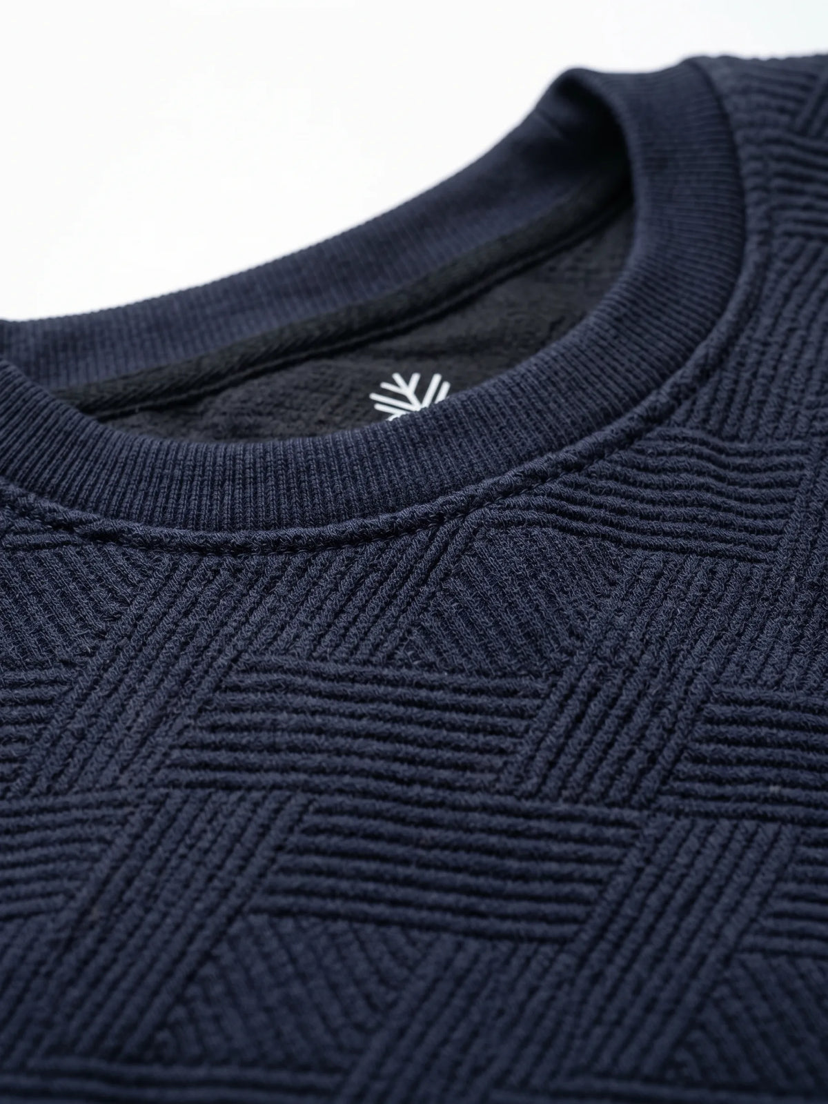 Close-up fabric and collar details of men's navy blue crewneck sweatshirt from TREE