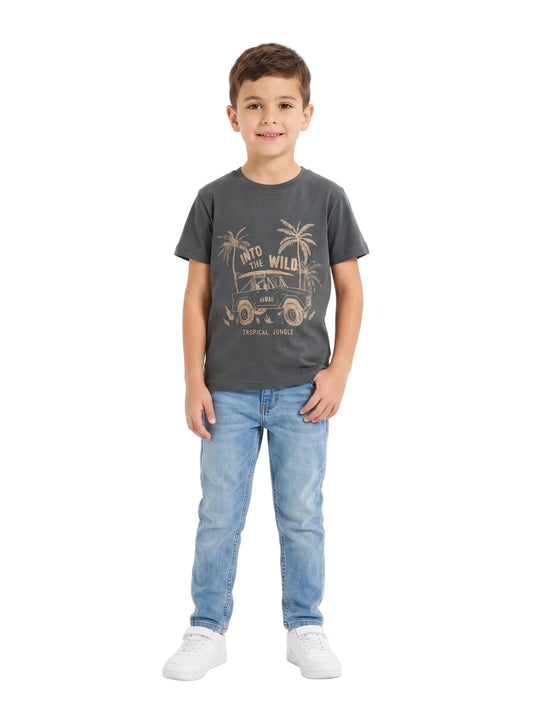 Front view of a young boy wearing a dark grey car print cotton t-shirt by TREE.