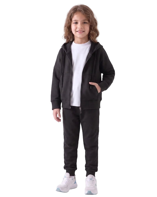 Front view of a young girl wearing an oversized summer milton jacket in black by TREE.