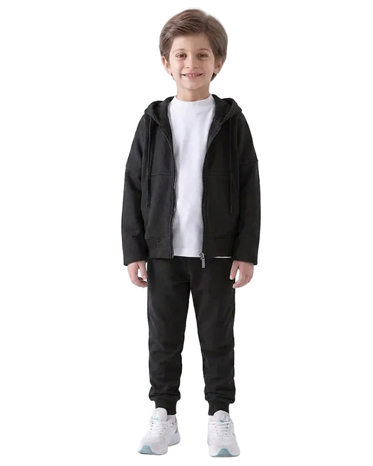 Front view of a young boy wearing an oversized summer milton jacket in black by TREE.