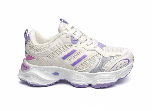 Multiple angle views of a girls' white and lavender fashion sneaker featuring a chunky sole and pull tab by TREE.