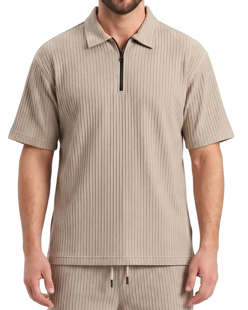 Front view of a man wearing a beige pleated zip polo shirt