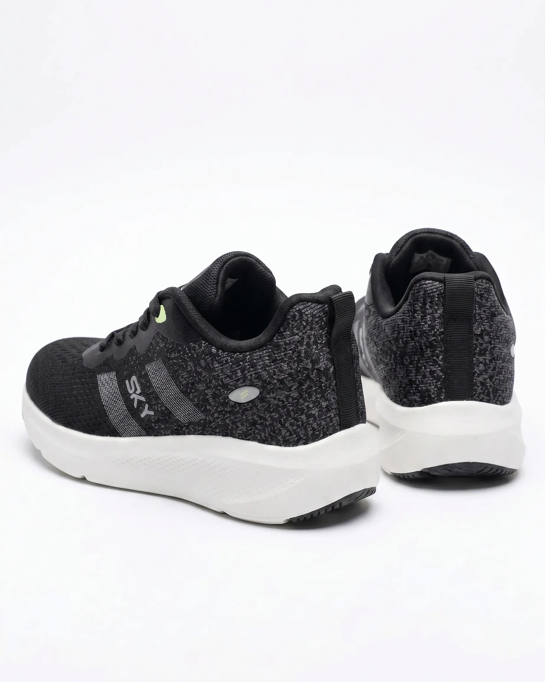 Front view of a kids' black fashion sneaker featuring a chunky sole, SKY branding, and pull tab by TREE.
