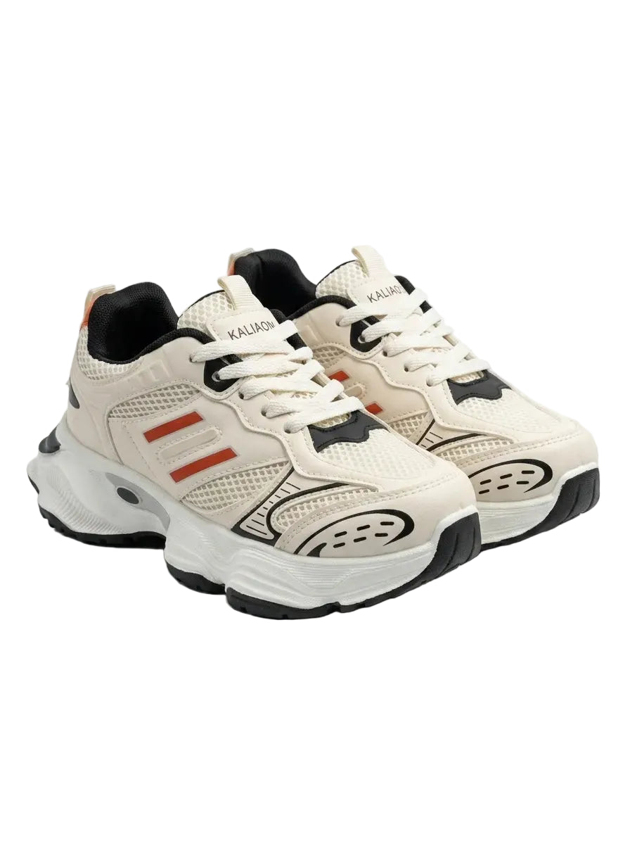 Front view of a kids' beige fashion sneaker featuring a chunky sole, orange stripes, black details, and pull tab by TREE.