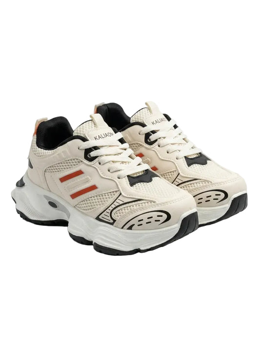Front view of a kids' beige fashion sneaker featuring a chunky sole, orange stripes, black details, and pull tab by TREE.