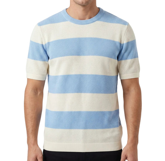 A man wearing a summer horizontal striped knit t-shirt with a textured finish and crew neck, paired with casual pants.