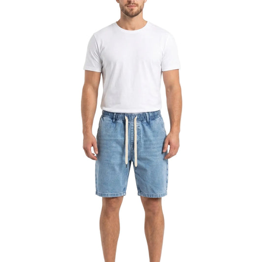 Front view of a model wearing men's iced denim oversized 100% cotton shorts by TREE.