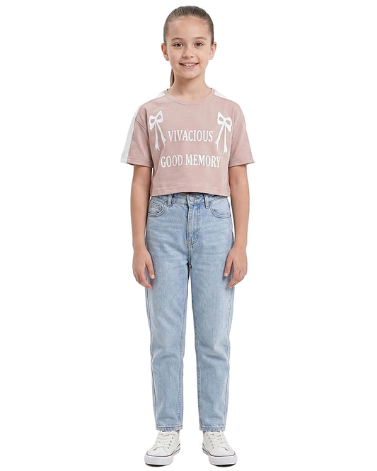 Front view of a girls' graphic printed t-shirt featuring slogan and bow details in a regular fit by TREE.
