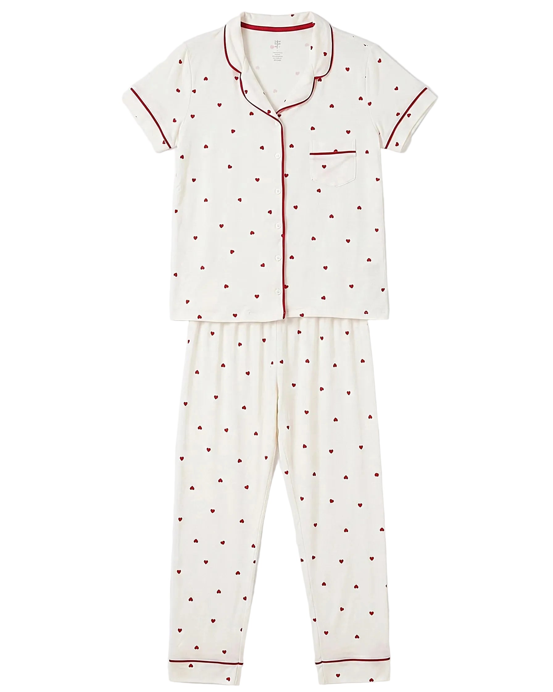 Front view of a women's creamy white pajama set featuring a red heart print and contrast piping by TREE.