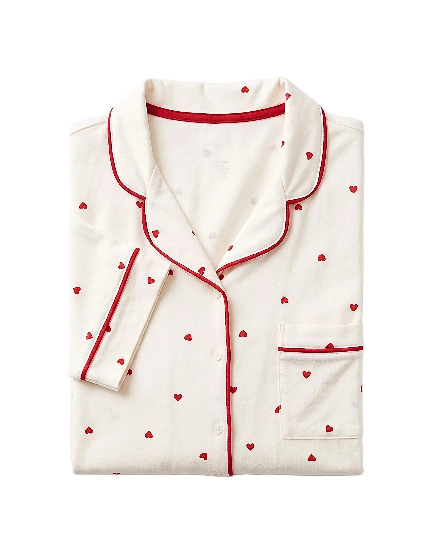 Front view of a women's creamy white pajama set featuring a red heart print and contrast piping by TREE.