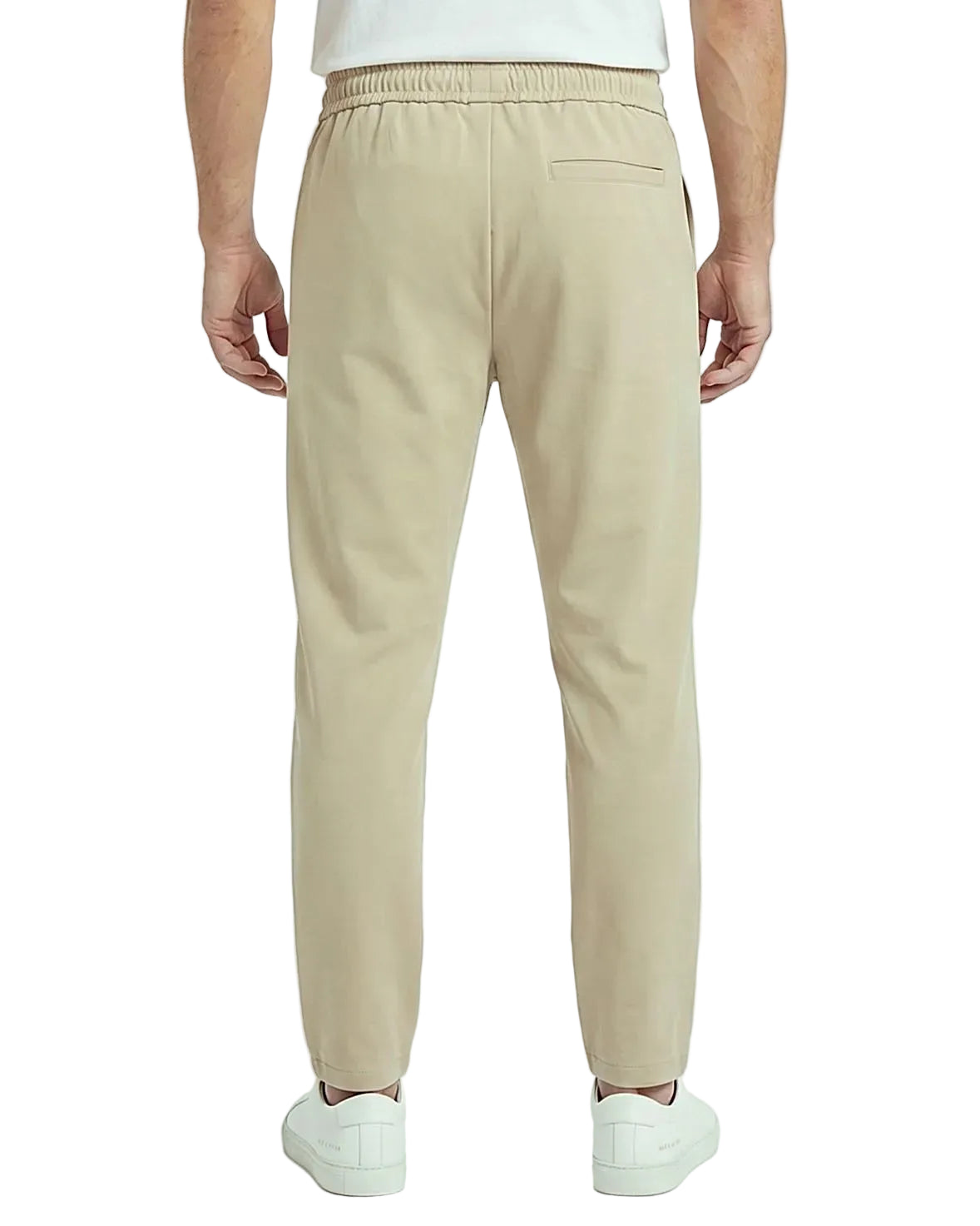 Back view of a men's beige regular-fit sarouel pants featuring an elastic waistband and structured pockets by TREE.