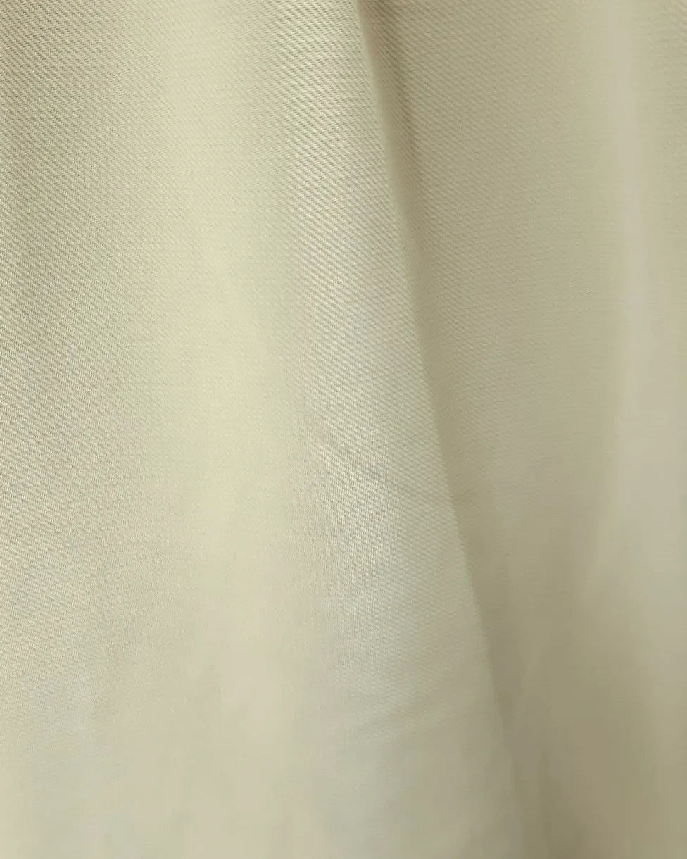 Back view of a men's beige regular-fit sarouel pants featuring an elastic waistband and structured pockets by TREE.