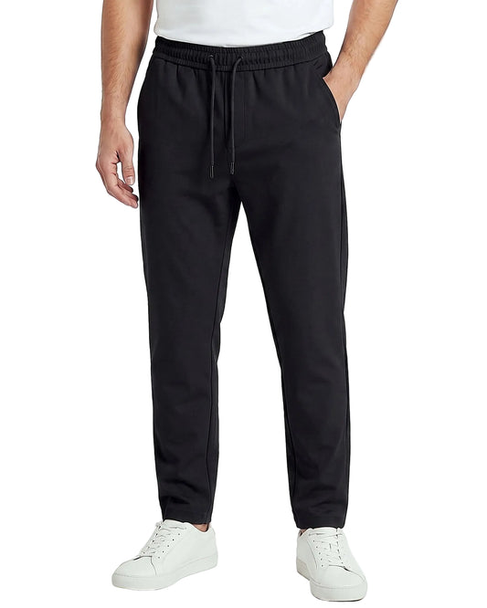 Back view of a men's beige regular-fit sarouel pants featuring an elastic waistband and structured pockets by TREE.