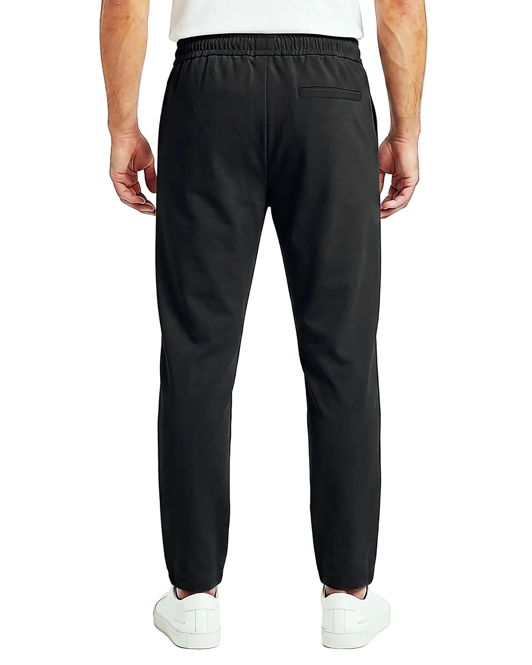 Back view of a men's beige regular-fit sarouel pants featuring an elastic waistband and structured pockets by TREE.