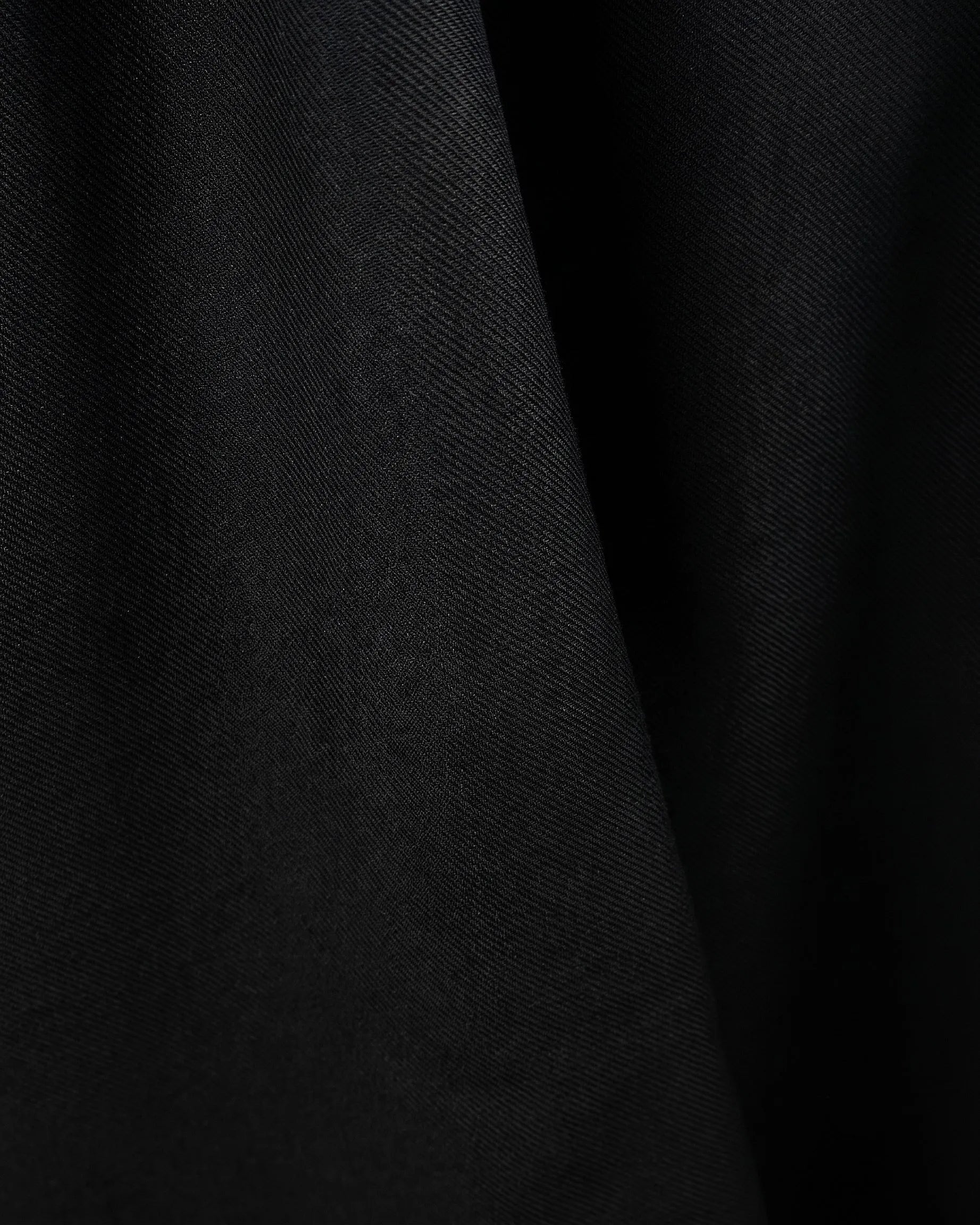 Back view of a men's beige regular-fit sarouel pants featuring an elastic waistband and structured pockets by TREE.