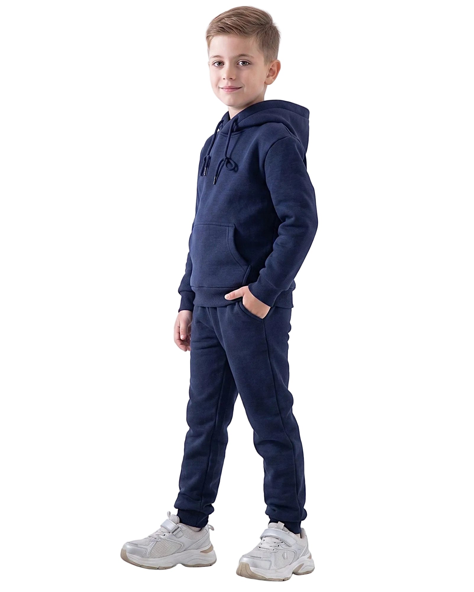 Front view of a boy wearing navy pants in a relaxed fit by TREE.