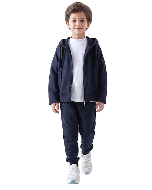 Front view of a boy wearing a dark navy kids' oversized zip hoodie jacket by TREE.