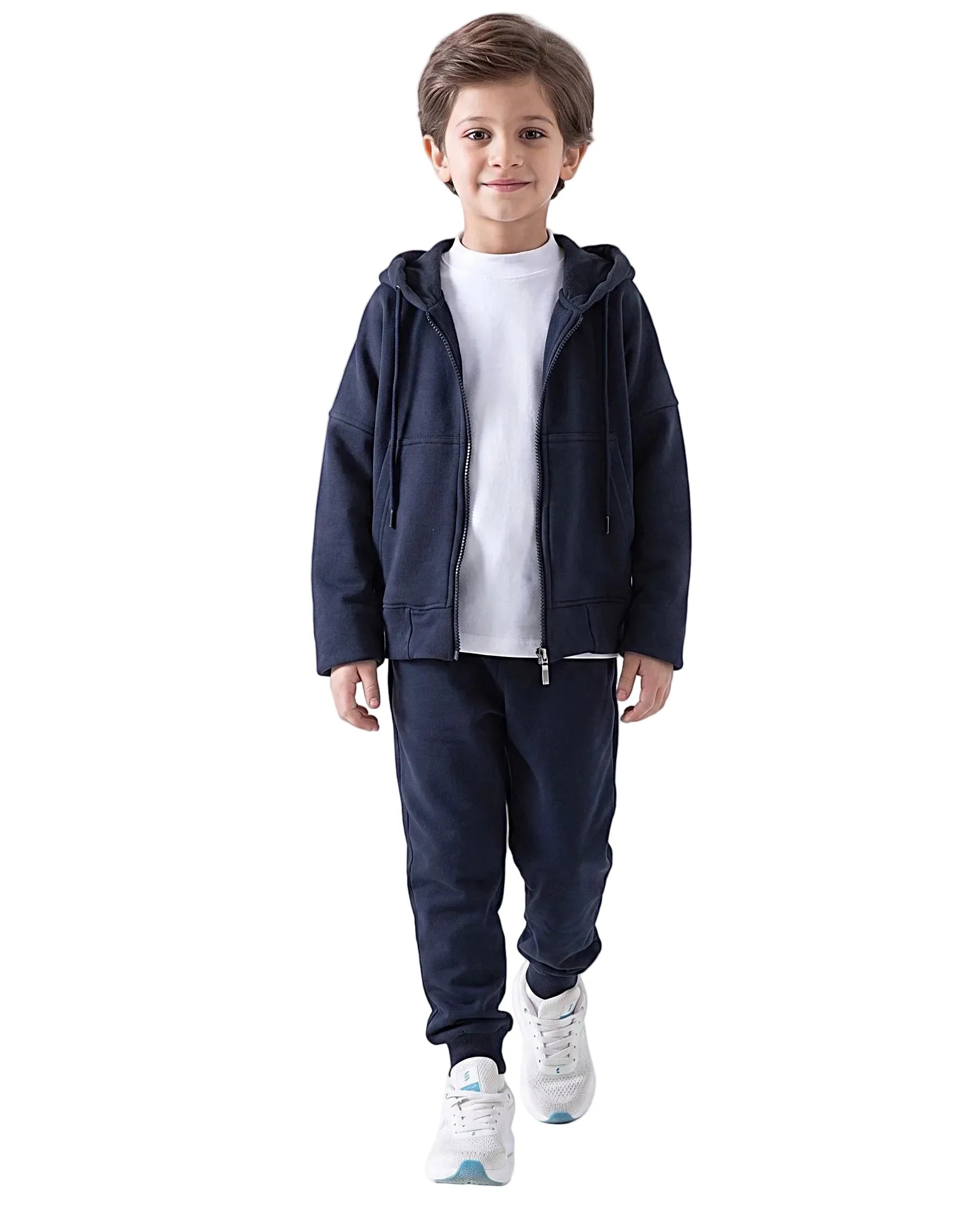 Boy modeling an open dark navy kids' oversized milton zip hoodie over a white t-shirt, with matching sweatpants by TREE