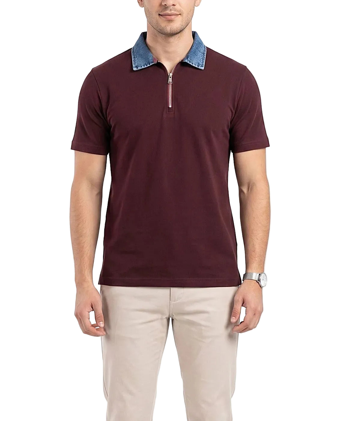 Detailed front shot of the model wearing the burgundy polo with a denim collar and beige trousers