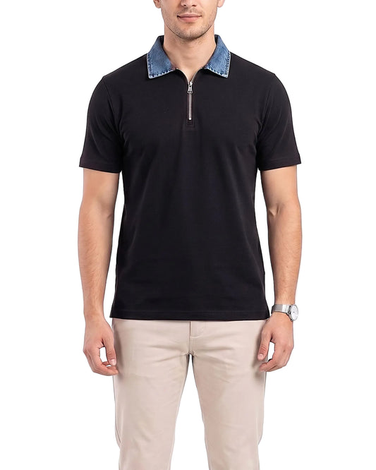 Detailed front shot of the model wearing the black denim collar polo with beige pants.