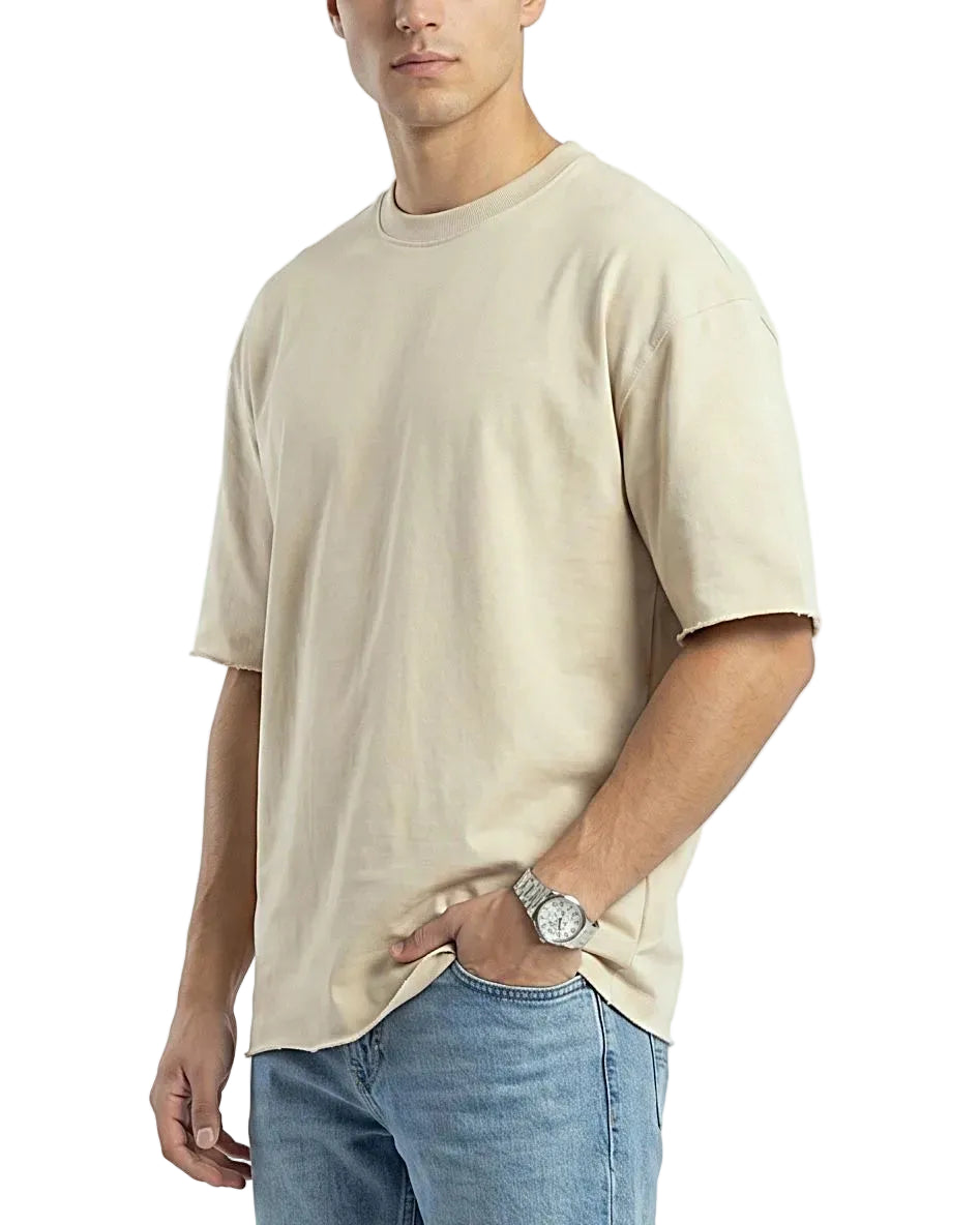 Front view of a model wearing a men's oversized 100% polyester t-shirt with raw edges by TREE.