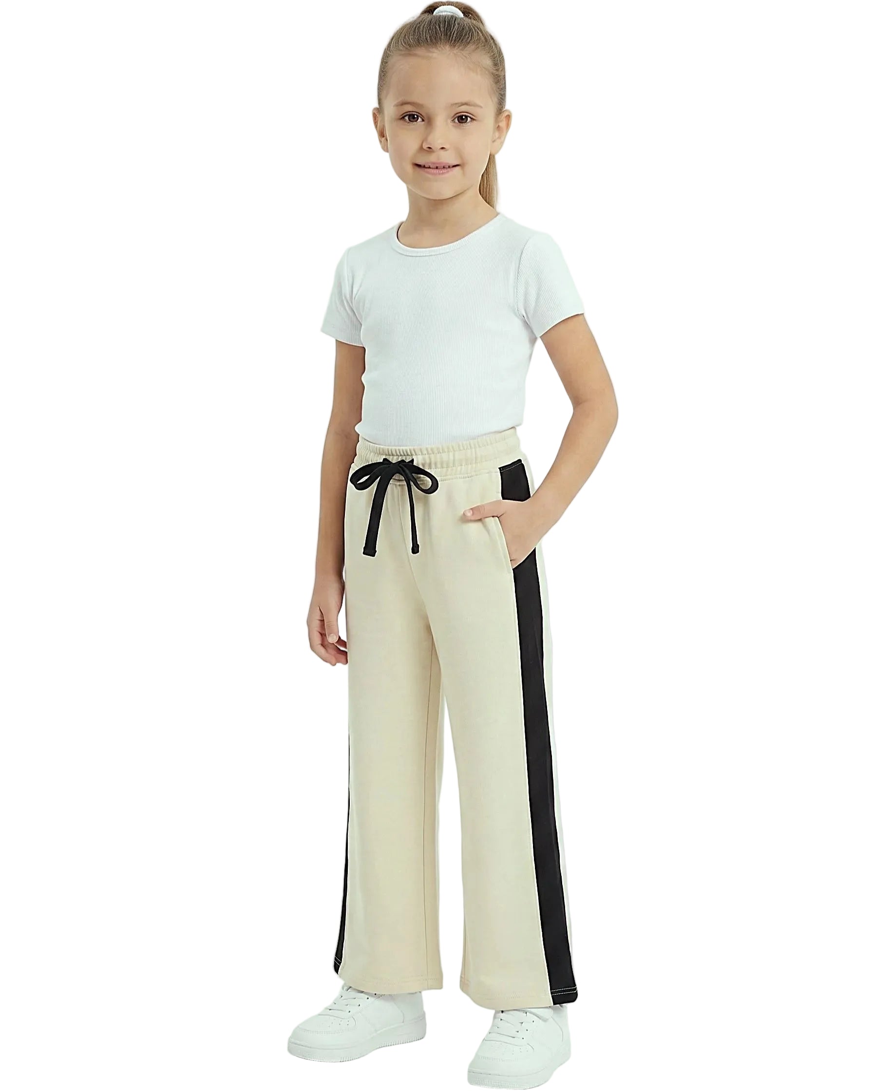 Front view of a young girl wearing girls' summer side-stripe wide-leg pants featuring an elastic waist and drawstring tie by TREE.