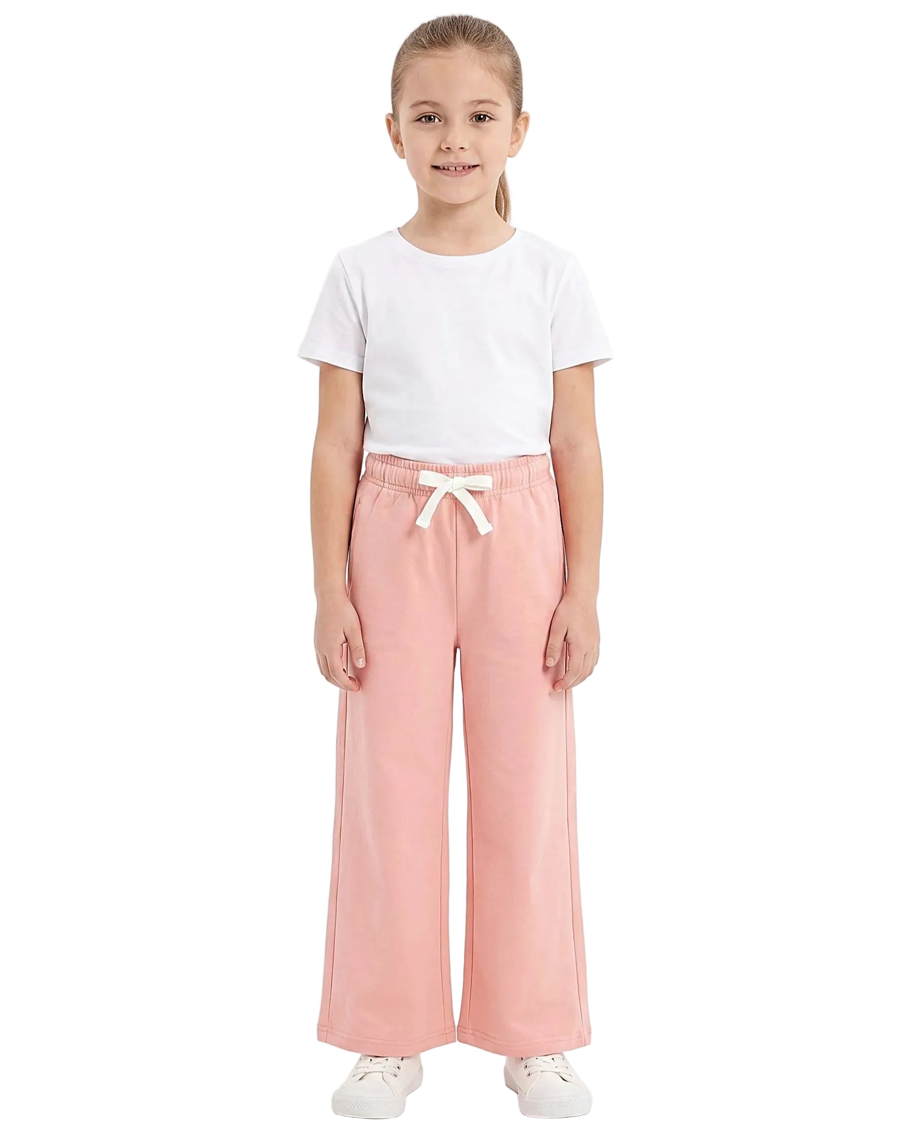 Front view of a young girl wearing girls' summer wide-leg pants featuring an elastic waist and drawstring tie by TREE.