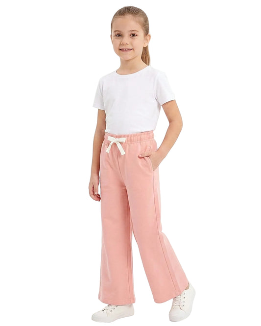 Front view of a young girl wearing girls' summer wide-leg pants featuring an elastic waist and drawstring tie by TREE.