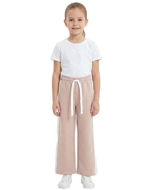 Front view of a young girl wearing girls' summer side-stripe wide-leg pants featuring an elastic waist and drawstring tie by TREE.