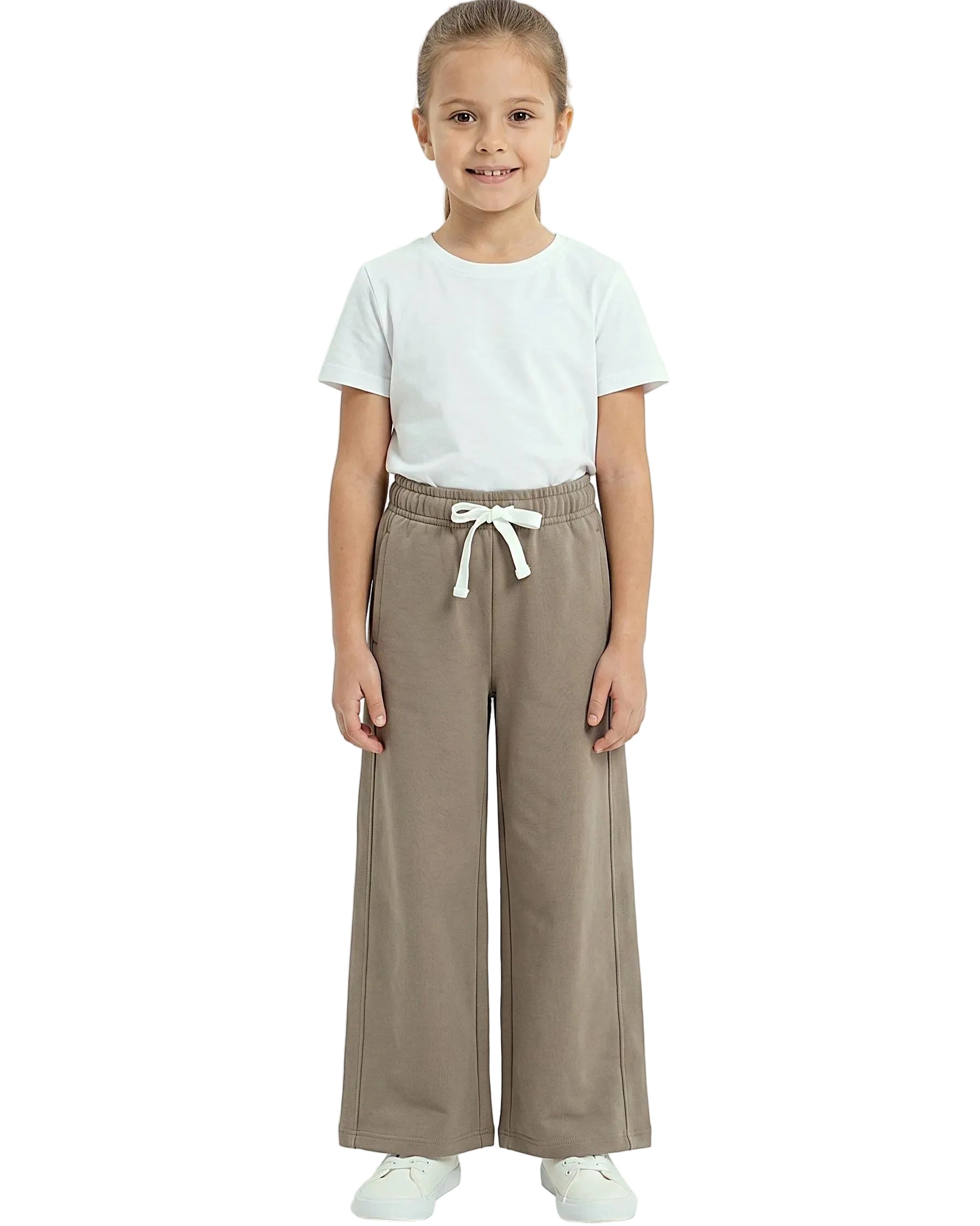 Front view of a young girl wearing girls' summer wide-leg pants featuring an elastic waist and drawstring tie by TREE.