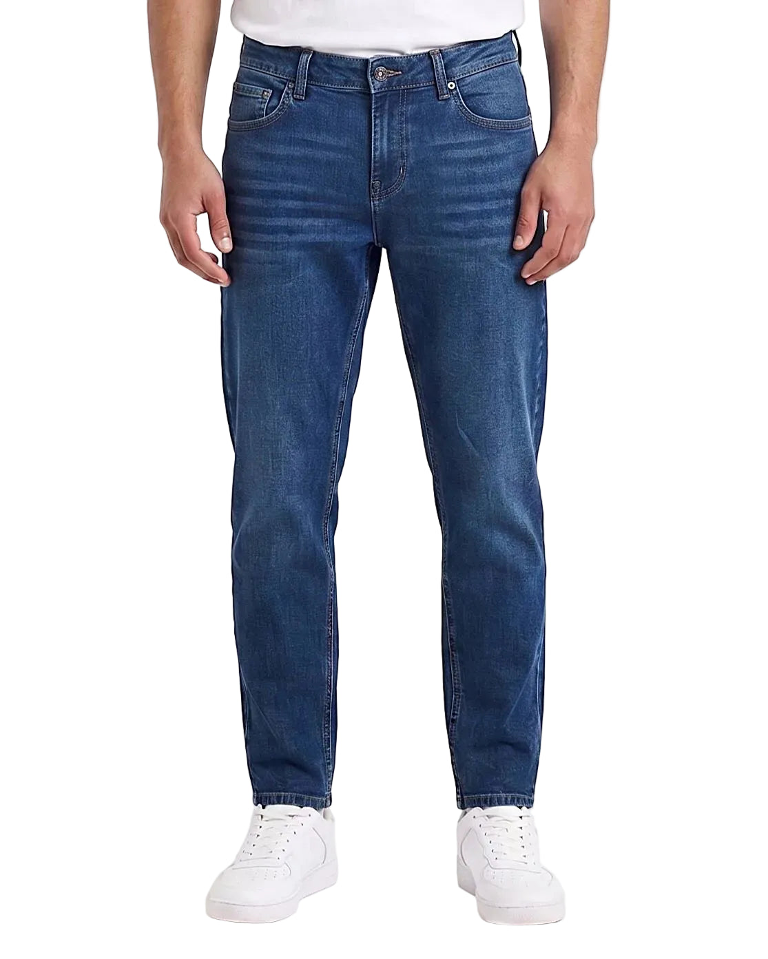 Front view of a model wearing men's boyfriend fit jeans in a classic wash by TREE.